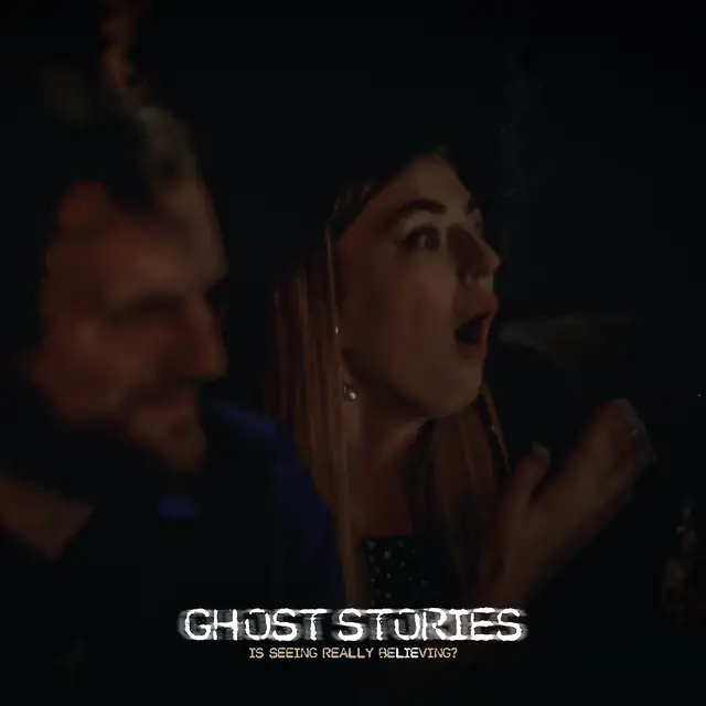 A guest gasping in shock beside her companion