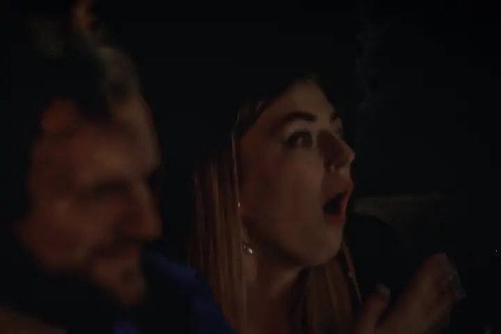A guest gasping in the candlelight